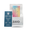 A white coffee bag with a black ZAVO logo stamped on the bottom of the bag, there is two product cards one is blue and red multicoloured with a Hawk on it, the second is the tasting notes which says Strength Medium, Process Mountain Water, Enjoy as Espresso Filter, Tasting Notes Caramel, Vanilla, Nutty, Origin Mexico, Blend Espresso, The Hawk Delicious & Smooth